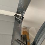 Broken Hinge and Roller of a garage door