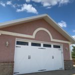 New barn style garage door after installation and paint and handles