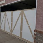 4 garage door panels being installed